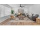 Comfortable living room featuring a large rug and ample seating at 1511 E Harmony Ave, Mesa, AZ 85204