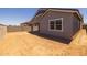 View of spacious backyard with block wall, ready for landscaping at 15620 W Georgia Dr, Surprise, AZ 85379
