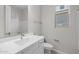 Bright bathroom features a modern vanity, updated fixtures, and a shower/tub combo at 15620 W Georgia Dr, Surprise, AZ 85379