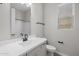Bright bathroom featuring a shower-tub combo and a vanity with a sink and a white countertop at 15620 W Georgia Dr, Surprise, AZ 85379