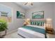 Well-lit bedroom with a cozy bed, side tables, a window, and stylish decor at 15620 W Georgia Dr, Surprise, AZ 85379