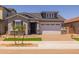 Charming single-Gathering home with a two-car garage, manicured lawn and desert landscape at 15620 W Georgia Dr, Surprise, AZ 85379
