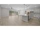Open floor plan with a kitchen island, stainless steel appliances, and access to the backyard at 15620 W Georgia Dr, Surprise, AZ 85379