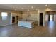 Open kitchen with island, white cabinets, granite countertops, and stainless steel appliances at 15620 W Georgia Dr, Surprise, AZ 85379
