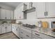 Modern kitchen featuring stainless steel appliances, granite countertops, and tile backsplash at 15620 W Georgia Dr, Surprise, AZ 85379