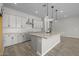 Stylish kitchen with an island, stainless steel appliances, and granite countertops at 15620 W Georgia Dr, Surprise, AZ 85379