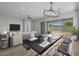 Open-concept living space with modern decor, comfortable seating, and bright lighting at 15620 W Georgia Dr, Surprise, AZ 85379