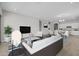Open-concept living space with a view of the dining area and kitchen with modern appliances at 15620 W Georgia Dr, Surprise, AZ 85379