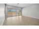 Bright living space with tiled floors and a sliding glass door leading to the backyard at 15620 W Georgia Dr, Surprise, AZ 85379