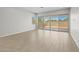 Bright living space with tiled floors and a sliding glass door leading to the backyard at 15620 W Georgia Dr, Surprise, AZ 85379