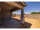 View of covered patio space with elegant support beams, perfect for entertaining at 15620 W Georgia Dr, Surprise, AZ 85379