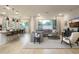 Spacious and open living room with modern furnishings and abundant natural light at 15695 W Christy Dr, Surprise, AZ 85379