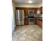 Kitchen with stainless steel appliances, tile floor, and backsplash at 1750 E Mateo Cir # 106, Mesa, AZ 85204