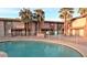 Community pool with palm trees at this townhome complex at 1750 E Mateo Cir # 106, Mesa, AZ 85204
