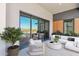 Relaxing balcony with comfortable seating, decorative plants and large sliding doors overlooking the city at 19355 N 73Rd Way # 4002, Scottsdale, AZ 85255