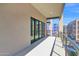 Bright and spacious balcony features a modern railing and overlooking the building under construction at 19355 N 73Rd Way # 4002, Scottsdale, AZ 85255