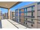 Spacious balcony featuring modern railing and stunning views of the building under construction at 19355 N 73Rd Way # 4002, Scottsdale, AZ 85255