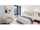 Minimalist bedroom design with a comfortable bed, a large window and modern decor at 19355 N 73Rd Way # 4002, Scottsdale, AZ 85255