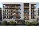 Modern apartment building exterior showcasing multiple balconies with outdoor seating areas and contemporary design at 19355 N 73Rd Way # 4002, Scottsdale, AZ 85255