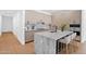 Modern kitchen with marble countertops, sleek cabinets, an island with seating, and stainless steel appliances at 19355 N 73Rd Way # 4002, Scottsdale, AZ 85255