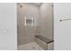 Contemporary shower with glass door, built-in bench, and tiled walls, creating a spa-like experience at 19355 N 73Rd Way # 4002, Scottsdale, AZ 85255