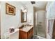 Bathroom featuring a shower, granite countertop, and tiled floors at 1941 E Hazelwood St, Phoenix, AZ 85016