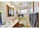 Bathroom featuring a shower, vanity, and tiled floors at 1941 E Hazelwood St, Phoenix, AZ 85016