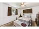 Bedroom featuring a queen bed, ceiling fan, and a window with natural light at 1941 E Hazelwood St, Phoenix, AZ 85016