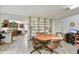 Dining area with a round wooden table, chairs, and built-in bookshelves, adjacent to the kitchen at 1941 E Hazelwood St, Phoenix, AZ 85016