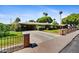 Exterior of a home with well-maintained landscaping, a covered carport, and a paved driveway at 1941 E Hazelwood St, Phoenix, AZ 85016
