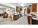 Traditional kitchen with ample cabinet space, tile flooring, and a view into the adjacent living area at 1941 E Hazelwood St, Phoenix, AZ 85016