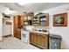 Functional kitchen featuring oak cabinetry, modern appliances, and plenty of counter space for meal preparation at 1941 E Hazelwood St, Phoenix, AZ 85016