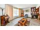 Cozy living room with a fireplace, comfortable seating, and natural light streaming through the windows at 1941 E Hazelwood St, Phoenix, AZ 85016