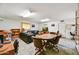 Spacious living room with tile flooring, comfortable seating, and a dining area at 1941 E Hazelwood St, Phoenix, AZ 85016