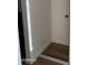 The image shows a walk-in closet with modern laminate flooring, white walls and white trim at 2121 W Royal Palm Rd # 2049, Phoenix, AZ 85021