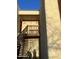 The building exterior shows 2 apartments; one with a wooden door and staircase leading to the upper unit at 2121 W Royal Palm Rd # 2049, Phoenix, AZ 85021