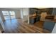 Open-concept living area adjacent to kitchen and sliding glass door for natural light at 2121 W Royal Palm Rd # 2049, Phoenix, AZ 85021