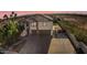 Two-story home with a tile roof, desert landscaping, an enclosed backyard, and an expansive driveway at 23214 N 106Th Ave, Peoria, AZ 85383