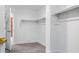 Functional walk-in closet with installed shelving and rod, offering ample storage space for an organized wardrobe at 23214 N 106Th Ave, Peoria, AZ 85383