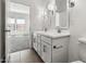 Bathroom features double sinks, modern fixtures, and is connected to a bedroom for privacy at 23419 W Albeniz Pl, Buckeye, AZ 85326