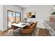Dining area showcasing a modern table setting and view to the backyard at 23419 W Albeniz Pl, Buckeye, AZ 85326