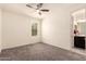 This room features a ceiling fan and an ensuite bathroom at 2440 W Arroyo Way, San Tan Valley, AZ 85144