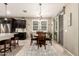 Bright dining area with a round table, comfortable chairs, and natural light from sliding glass doors at 2440 W Arroyo Way, San Tan Valley, AZ 85144