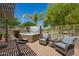 Outdoor hot tub on brick patio with two chairs at 2440 W Arroyo Way, San Tan Valley, AZ 85144