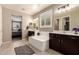 Inviting primary bathroom featuring soaking tub and dual sink vanities at 2440 W Arroyo Way, San Tan Valley, AZ 85144