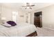 Relaxing main bedroom with ceiling fan, TV on dresser and ensuite bath access at 2440 W Arroyo Way, San Tan Valley, AZ 85144