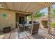 Covered outdoor patio with dining table and chairs at 2440 W Arroyo Way, San Tan Valley, AZ 85144