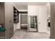 Spacious walk-in closet with custom shelving and organization system at 2440 W Arroyo Way, San Tan Valley, AZ 85144
