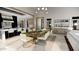 Open-concept dining area with light wood accents, stylish lighting, and modern furniture at 25015 S 182Nd Pl, Gilbert, AZ 85298