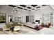Modern living room with an open layout, a fireplace, and stylish furniture at 25015 S 182Nd Pl, Gilbert, AZ 85298